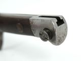 a close up of a metal object on a white surface
