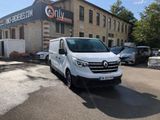 a white van that is parked in front of a building