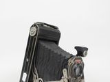 an old camera that is on display on a table