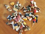 a pile of small figurines sitting on a wooden table