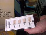a person holding a box with a bunch of keys in it