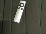 a remote control sitting on top of a mouse pad