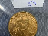 a close up of a gold coin with a label on it