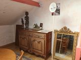 an image of a room with a table and a mirror