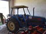 a tractor that is parked in a garage