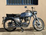 a motorcycle that is parked in front of a building