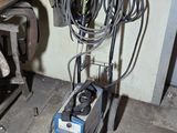 une photo d'un nettoyeur haute pression dans un garage