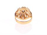 an image of a gold ring with a diamond in the center