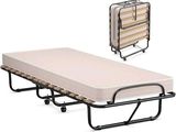 un lit pliant avec un matelas et une table pliante