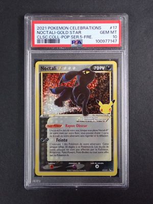 gros plan d'une carte pokemon sur une surface noire