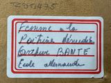 a sticker that has been placed on a piece of cardboard