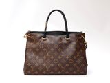 a louis vuitton handbag on a white background
