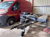 a red van that is being worked on in a garage