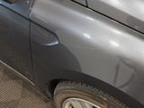 a close up of a car ' s door handle with a sticker on it