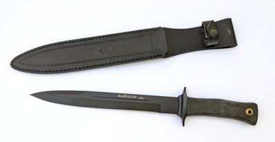 two knives are laying side by side on a white surface