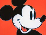 une image représentant un dessin de Mickey Mouse sur fond orange