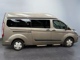 an image of a beige van parked in a garage