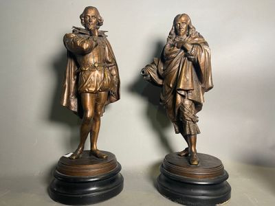 pair of antique bronze figures of a man and a woman