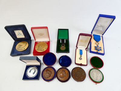 a lot of medals and other items on the table