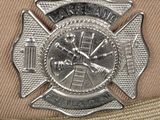 a badge on the hat of a firefighter