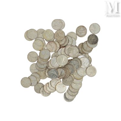 a pile of silver coins on a white surface