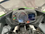 a close up of a motorcycle with a speedometer on it
