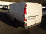 a white van that is parked in a parking lot