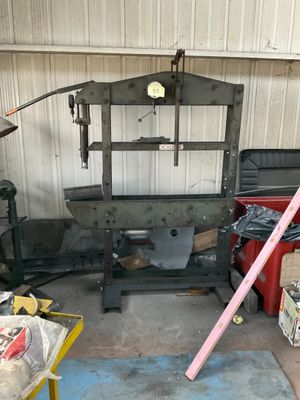 a picture of a garage with a large metal frame and tools