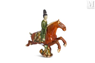 figurine of a man riding a horse on a white background