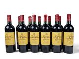 six bottles of red wine are lined up in a row