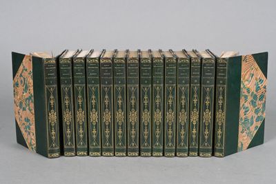 six books in a row with green covers and gold designs