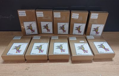 six boxes of chocolate sitting on top of a table next to each other