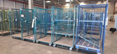 many cages that are in a warehouse with a lot of them
