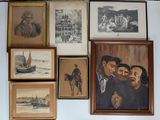 many pictures hanging on the wall of a room