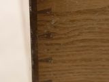 a close up of a drawer with a wooden handle