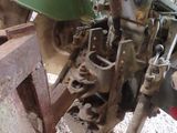 a tractor that is sitting on the ground in the dirt