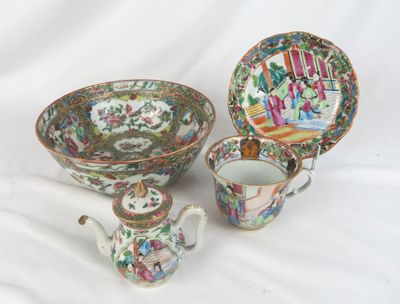 three pieces of chinese porcelain are sitting on a white surface