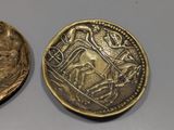 a gold coin with a picture of a man on it