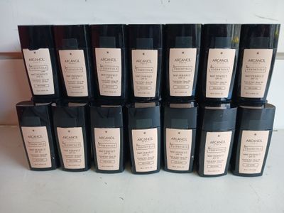 the bottles are lined up on the counter with labels on them