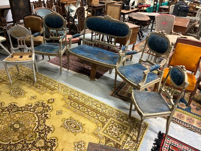 many chairs and tables in a room with a rug on the floor