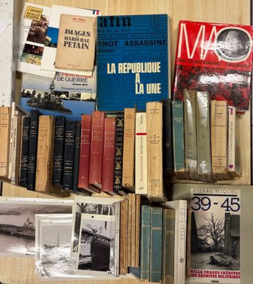 a lot of books on a table with pictures on it