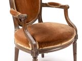 une image représentant une chaise dont l'assise est recouverte de velours marron