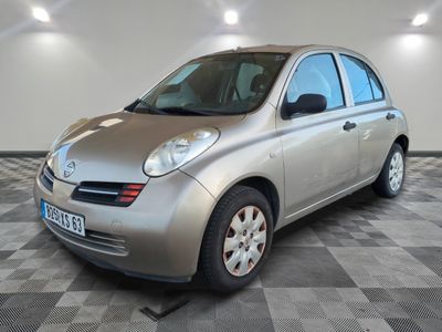 a picture of a silver car parked in a garage