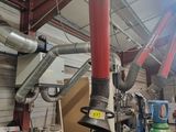 many pipes that are hanging from the ceiling of a building