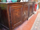 a large wooden cabinet with two doors on the side