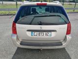 a silver car that is parked in a parking lot