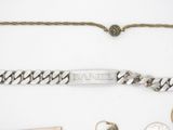 a silver bracelet with a name plate on it