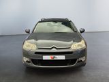 grey citrole parked in a large room with a white wall