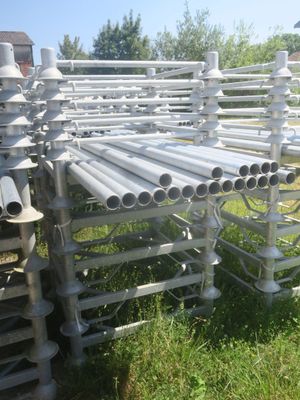 a lot of pipes that are sitting in the grass