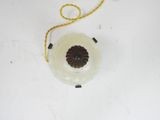 an overhead view of a plastic object on a white surface